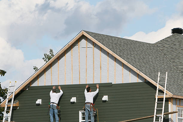 Professional Storm Damage Siding Repair technician working in Hampton, MN
